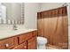 Well-lit bathroom featuring a vanity with storage and a shower with a decorative shower curtain at 19106 Mallard Dr # 216, Fort Mill, SC 29707
