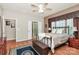 Comfortable bedroom featuring wood floors, a ceiling fan, and an ensuite bathroom at 19106 Mallard Dr # 216, Fort Mill, SC 29707