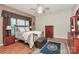 Cozy bedroom with wood floors, ceiling fan, a large window, and classic furniture at 19106 Mallard Dr # 216, Fort Mill, SC 29707