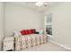 Inviting bedroom with a comfortable bed, soft carpet, and a bright window at 19106 Mallard Dr # 216, Fort Mill, SC 29707