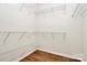 Spacious walk-in closet with wood floors and ample shelving for storage and organization at 19106 Mallard Dr # 216, Fort Mill, SC 29707