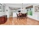 Open dining room with hardwood floors and large windows, adjacent to the kitchen, provides a great entertaining space at 19106 Mallard Dr # 216, Fort Mill, SC 29707