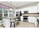 Modern kitchen with stainless steel appliances, white cabinets, and a breakfast bar offers a functional space at 19106 Mallard Dr # 216, Fort Mill, SC 29707