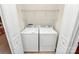 Laundry closet with washer, dryer and shelving for storage at 19106 Mallard Dr # 216, Fort Mill, SC 29707