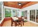 Charming sunroom with wood paneled ceiling, many windows, and a dining table at 19106 Mallard Dr # 216, Fort Mill, SC 29707