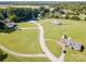 Wide aerial view of the property featuring multiple residences, lush greenery, and long driveways at 1918 Gables Dr, Monroe, NC 28112