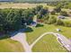 Expansive aerial view showcasing the home, large yard, pond, and surrounding landscape at 1918 Gables Dr, Monroe, NC 28112