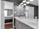 Modern bathroom featuring double sinks, updated fixtures, and access to the adjacent bedroom at 1918 Gables Dr, Monroe, NC 28112