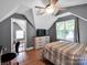 Bedroom with gray walls, a ceiling fan, wood flooring, and a bright window at 1918 Gables Dr, Monroe, NC 28112