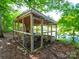 Backyard chicken coop providing a functional space for raising chickens in a natural setting at 1918 Gables Dr, Monroe, NC 28112