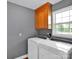 Functional laundry room with modern appliances, convenient storage, and a bright window at 1918 Gables Dr, Monroe, NC 28112