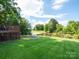 Scenic pond view from the backyard with a deck, offering a tranquil outdoor space at 1918 Gables Dr, Monroe, NC 28112