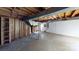 Spacious unfinished basement with exposed beams, concrete floors, and ample storage potential at 2001 Lakeview Dr, Pineville, NC 28134