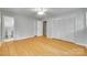 Large bedroom has wood flooring, a ceiling fan, and a private bathroom at 2001 Lakeview Dr, Pineville, NC 28134