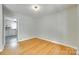 Cozy bedroom featuring hardwood floors, ample natural light, and neutral paint colors at 2001 Lakeview Dr, Pineville, NC 28134