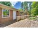 View of the home's wooden deck, offering an outdoor space for relaxing and entertaining at 2001 Lakeview Dr, Pineville, NC 28134
