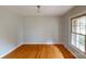 Formal dining room featuring hardwood floors, natural light from the windows, and neutral paint at 2001 Lakeview Dr, Pineville, NC 28134