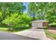 View of home with a two-car garage and well maintained landscaping at 2001 Lakeview Dr, Pineville, NC 28134