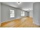 Bright living room with hardwood floors, large windows, and neutral color scheme at 2001 Lakeview Dr, Pineville, NC 28134