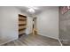 Bright bedroom with modern vinyl floors, a ceiling fan, and ample storage space at 2026 Willow Ridge St, Conover, NC 28613