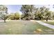 Expansive front yard with mature trees and a sidewalk leading up to the charming home at 2026 Willow Ridge St, Conover, NC 28613
