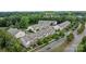 Overhead view of townhomes with brick accents and manicured landscaping in a lush, green neighborhood at 206 Overstone Ct, Fort Mill, SC 29715