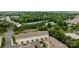 Townhome community with garages and neutral exteriors amidst mature trees at 206 Overstone Ct, Fort Mill, SC 29715