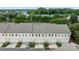 Aerial view of a townhome complex with attached garages, well-manicured lawns, and tree-lined streets creating a desirable community at 206 Overstone Ct, Fort Mill, SC 29715