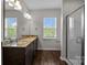 Bright bathroom featuring granite double vanity and separate glass enclosed shower at 206 Overstone Ct, Fort Mill, SC 29715