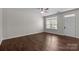Spacious bedroom featuring hardwood floors and a window that brings in natural light at 206 Overstone Ct, Fort Mill, SC 29715