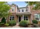Inviting townhome with brick accents and well-maintained front yard landscaping at 206 Overstone Ct, Fort Mill, SC 29715