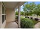 Inviting front porch with ornamental grasses, sidewalk, and street lined with trees, creating an eye-catching curb appeal at 206 Overstone Ct, Fort Mill, SC 29715