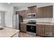 Well-equipped kitchen with stainless steel appliances and ample cabinet space at 206 Overstone Ct, Fort Mill, SC 29715