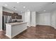 Kitchen with stainless appliances, an island with seating, and hardwood flooring at 206 Overstone Ct, Fort Mill, SC 29715