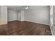Open-concept living room with hardwood floors, ceiling fan and lots of light at 206 Overstone Ct, Fort Mill, SC 29715