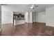 Open floor plan with hardwood floors, connecting kitchen and living spaces at 206 Overstone Ct, Fort Mill, SC 29715