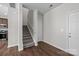 Interior staircase with carpeted steps and a nearby entry door at 206 Overstone Ct, Fort Mill, SC 29715