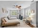 Inviting bedroom features two twin beds, a cozy reading nook, and bright natural light at 2615 Chesterfield Ave, Charlotte, NC 28205