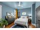 Charming bedroom featuring modern decor, a ceiling fan, and a neon sign at 2615 Chesterfield Ave, Charlotte, NC 28205