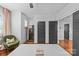 Stylish bedroom features a wine fridge, hardwood floors, and modern gray doors at 2615 Chesterfield Ave, Charlotte, NC 28205