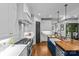 Spacious kitchen featuring stainless steel appliances, a large island, and views into an adjoining room at 2615 Chesterfield Ave, Charlotte, NC 28205