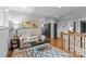 Cozy living room with a comfortable sofa, hardwood floors, and artwork on the walls at 2615 Chesterfield Ave, Charlotte, NC 28205