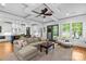 Inviting living room with stylish furniture, backyard views, and open floor plan into the kitchen at 2615 Chesterfield Ave, Charlotte, NC 28205