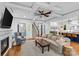 Cozy living room boasts coffered ceilings, modern fireplace, and opens to the kitchen and staircase at 2615 Chesterfield Ave, Charlotte, NC 28205