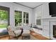 Bright living room featuring a fireplace, window seating, and a comfortable seating arrangement at 2615 Chesterfield Ave, Charlotte, NC 28205