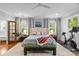 Bright, spacious main bedroom with natural light, a Peloton, and hardwood floors at 2615 Chesterfield Ave, Charlotte, NC 28205