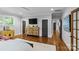 Spacious main bedroom featuring hardwood floors and a large dresser at 2615 Chesterfield Ave, Charlotte, NC 28205