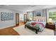 Bright, spacious main bedroom with ensuite access and hardwood floors at 2615 Chesterfield Ave, Charlotte, NC 28205