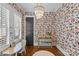 Bright office space featuring playful wallpaper, hardwood floors, and modern light fixture at 2615 Chesterfield Ave, Charlotte, NC 28205