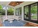 Inviting outdoor porch with comfortable seating, a ceiling fan, and a stylish rug, perfect for relaxation at 2615 Chesterfield Ave, Charlotte, NC 28205